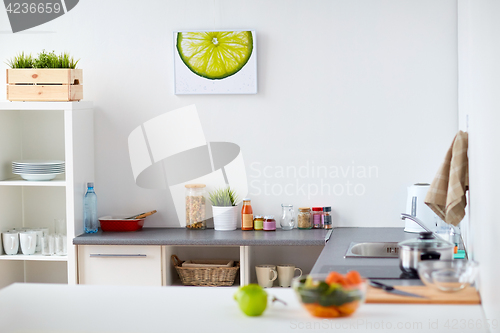 Image of modern home kitchen interior with food on table
