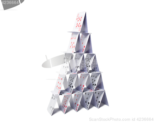 Image of house of playing cards over white background