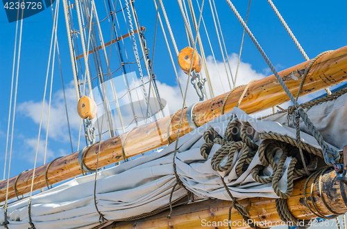 Image of Folded sail and mast on an old sailboat