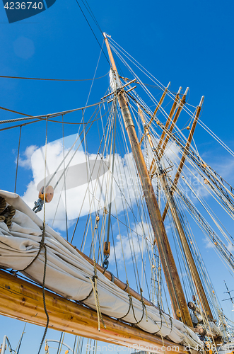 Image of Folded sail and mast on an old sailboat