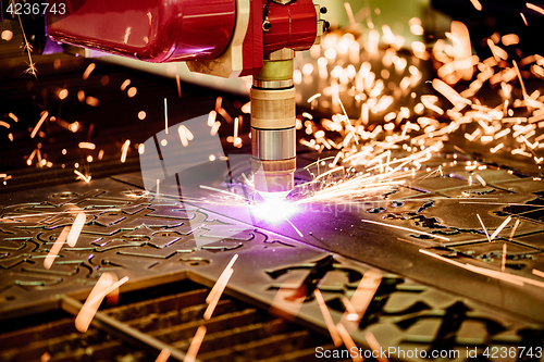 Image of CNC Laser plasma cutting of metal, modern industrial technology.