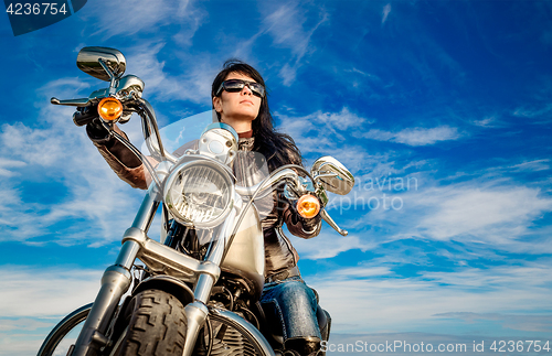 Image of Biker girl on a motorcycle