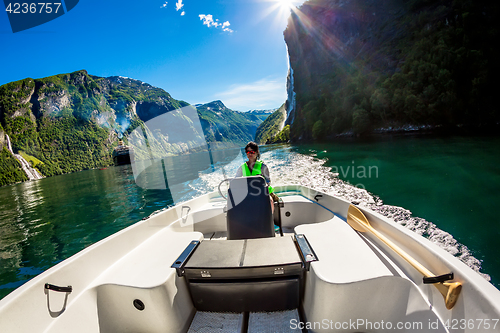 Image of Woman driving a motor boat