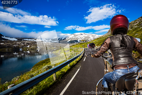 Image of Biker girl First-person view, mountain serpentine.