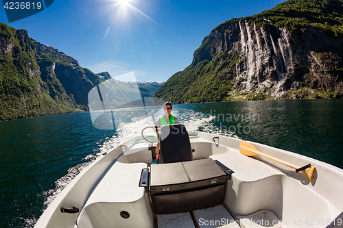 Image of Woman driving a motor boat