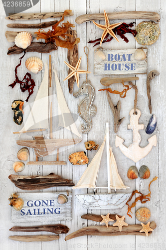 Image of Decorative Sailing Boats, Signs, Seashells and Driftwood 