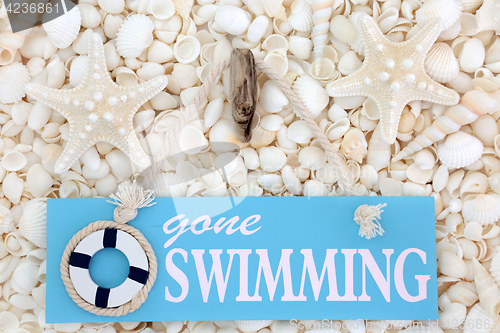 Image of Gone Swimming Sign on Seashells