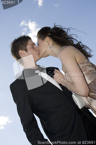 Image of young happy couple kissing