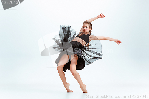 Image of Young girl break dancing