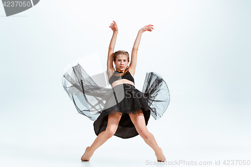 Image of Young girl break dancing