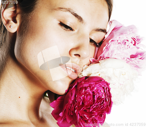 Image of young beauty woman with flower peony pink closeup makeup soft te