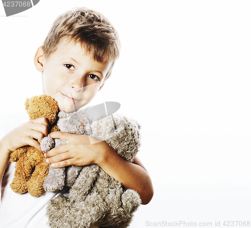 Image of little cute boy with many teddy bears hugging isolated close up