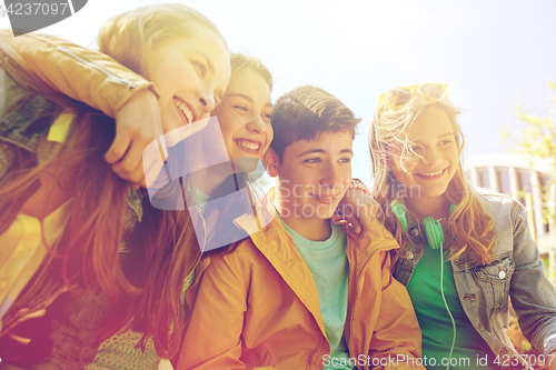 Image of happy teenage students or friends outdoors