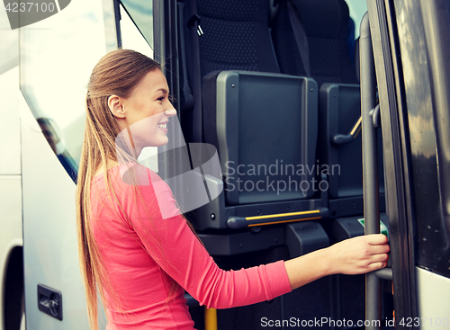 Image of happy passenger boarding on travel bus