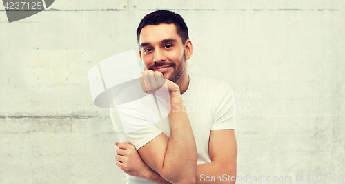 Image of smiling man over gray background