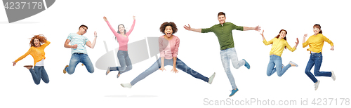 Image of happy people or friends jumping in air over white