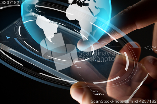 Image of close up of hands with smartphone and earth