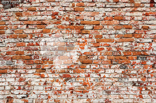 Image of detail of real textural damaged brick wall