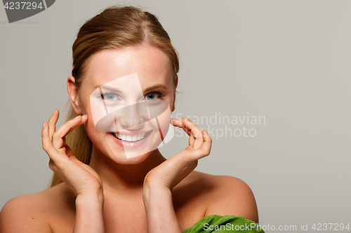 Image of Smiling girl on gray background