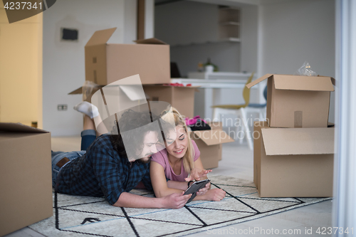 Image of Young couple moving in a new flat