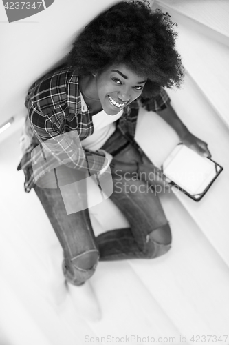 Image of black woman using her electronic tablet