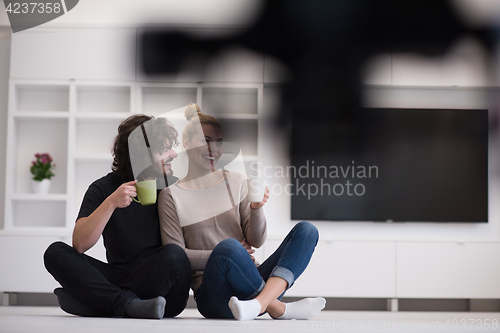 Image of young couple in their new home