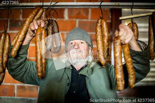 Image of Old man with sausages
