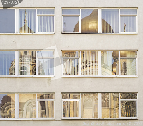 Image of church reflecting in office windows