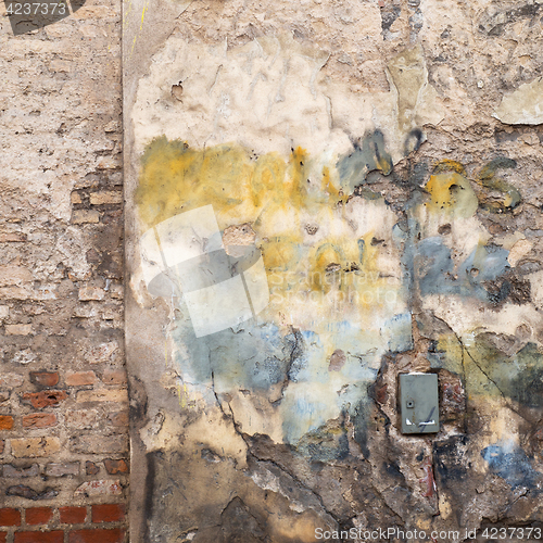 Image of colorful abandoned brick wall