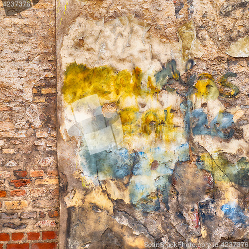 Image of colorful abandoned brick wall