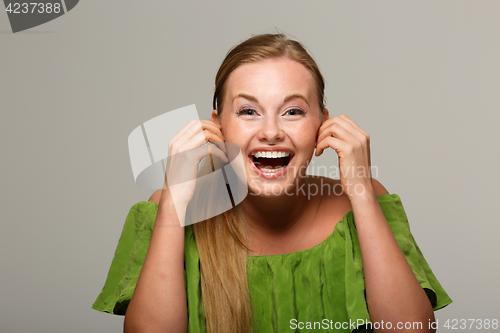 Image of Laughing model with open shoulders