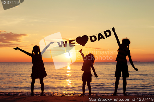 Image of Happy children playing on the beach