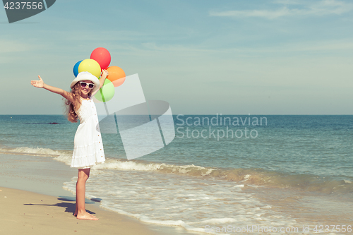 Image of Teen girl  standing on the beach