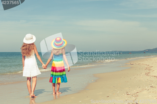 Image of Happy children playing on the beach