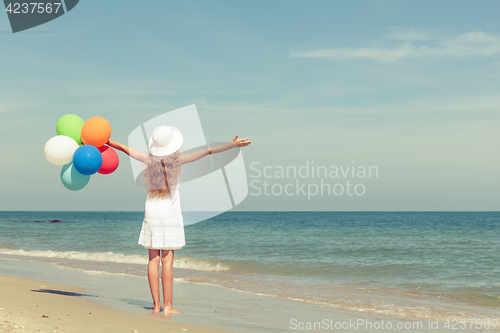 Image of Teen girl  standing on the beach