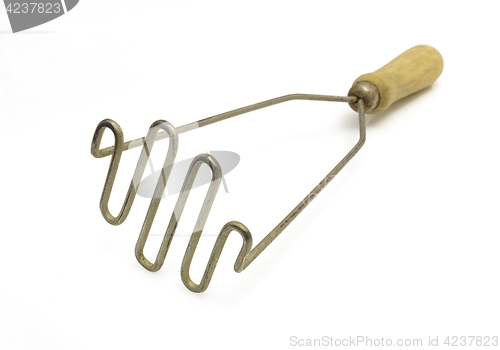 Image of pestle for preparation of potatoes the kitchen tool on a white background