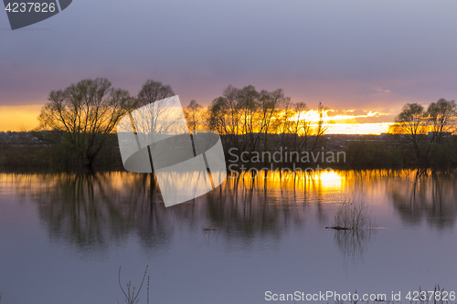 Image of Landscape sunset on the lake with trees