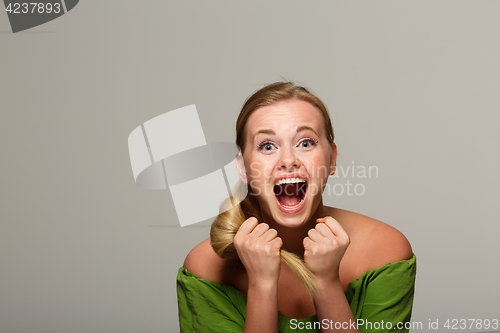 Image of Screaming woman in green dress