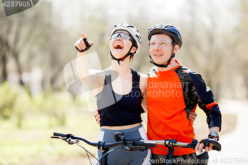 Image of Cheerful young athletes in helmets