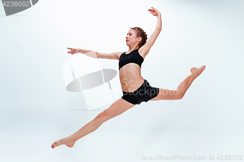 Image of The girl jumping as modern ballet dancer