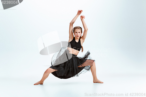 Image of Young girl break dancing