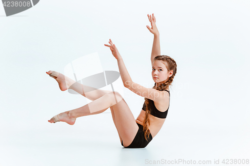 Image of Young girl break dancing