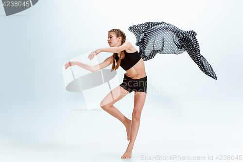 Image of Young girl break dancing