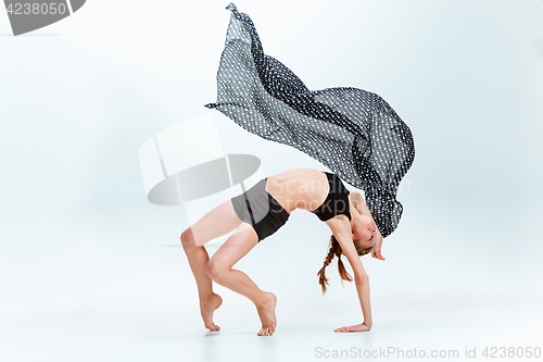 Image of Young girl break dancing