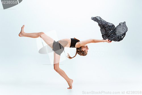 Image of Young girl break dancing