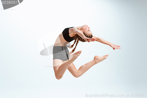 Image of Young girl break dancing