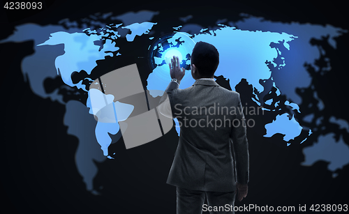 Image of businessman working with virtual world map