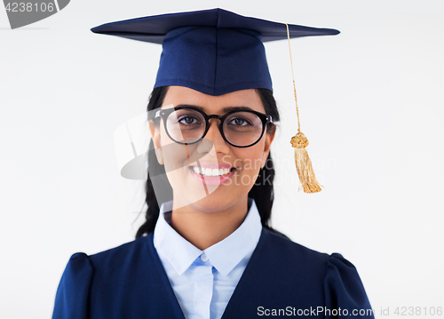 Image of happy bachelor woman in mortarboard with diplomas