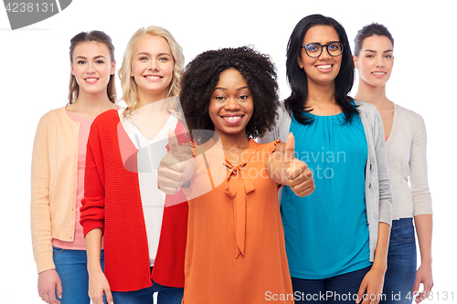 Image of international group of women showing thumbs up