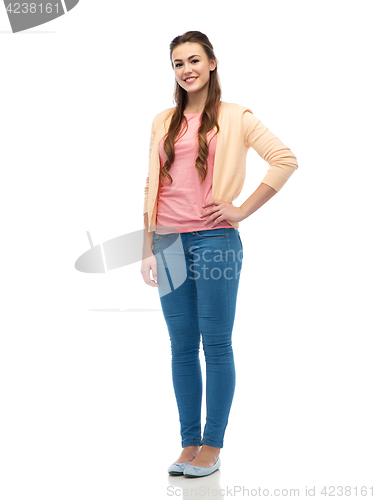 Image of happy smiling young woman in cardigan and jeans